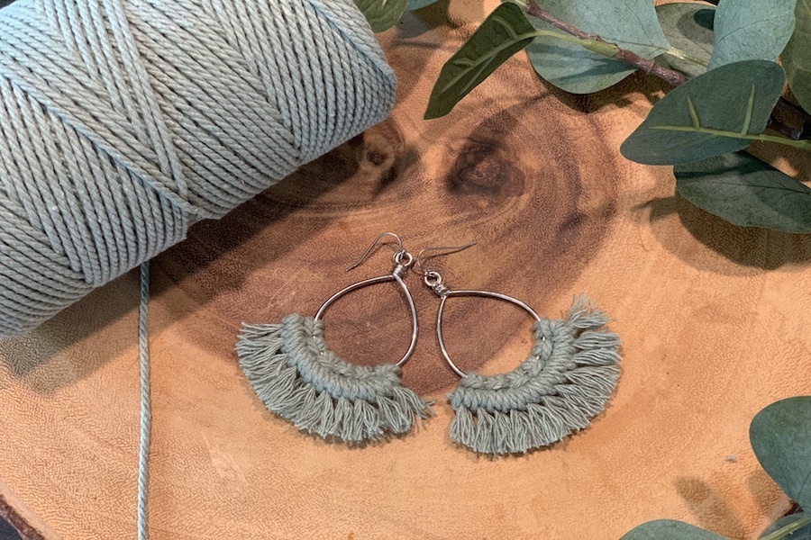 Pair of blue handmade macrame earrings. 