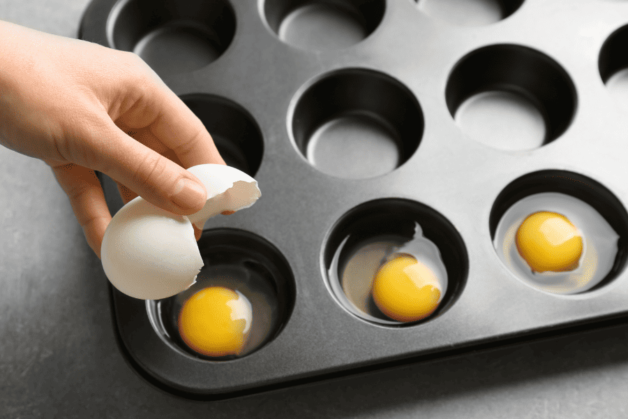 Cracking eggs into muffin tins to make Fresh Eggs Last longer