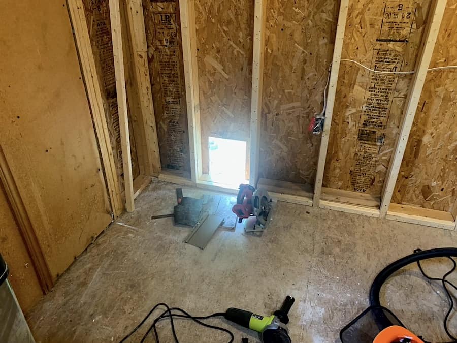 The inside of our chicken coop after we cut out the chicken door. 