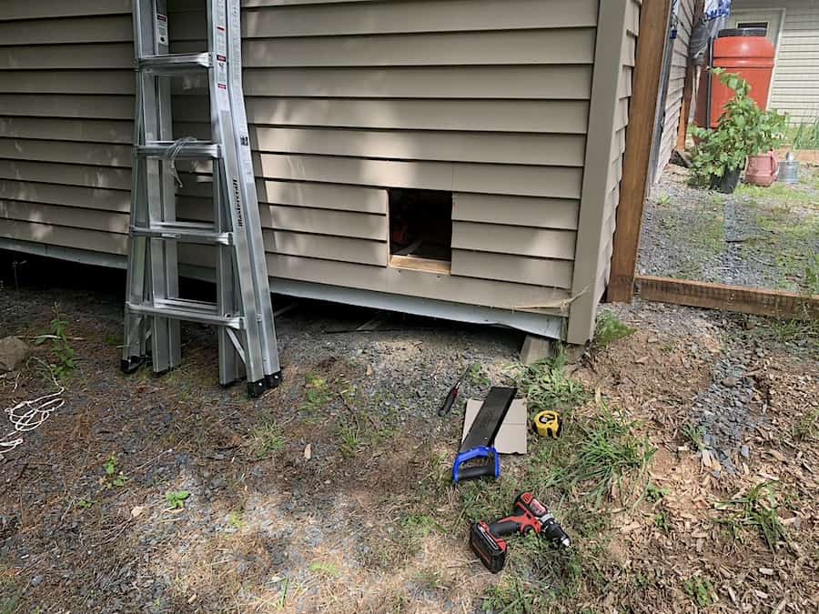 The outside of our chicken coop after we cut out the chicken door. 