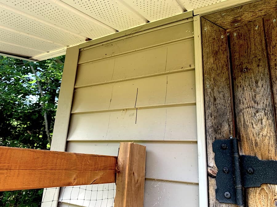 Measures and cuts of where the vents will be installed in the chicken coop/tool shed.