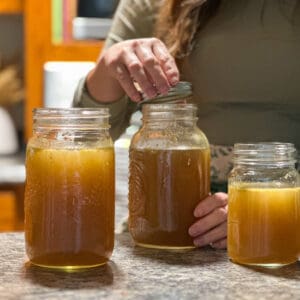 Three jars of homemade turkey bone broth.