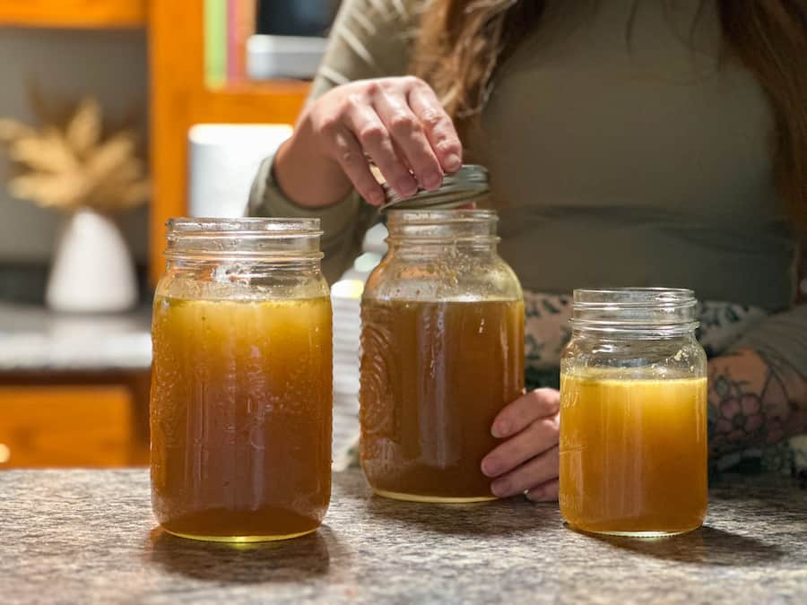 Three jars of homemade turkey bone broth.