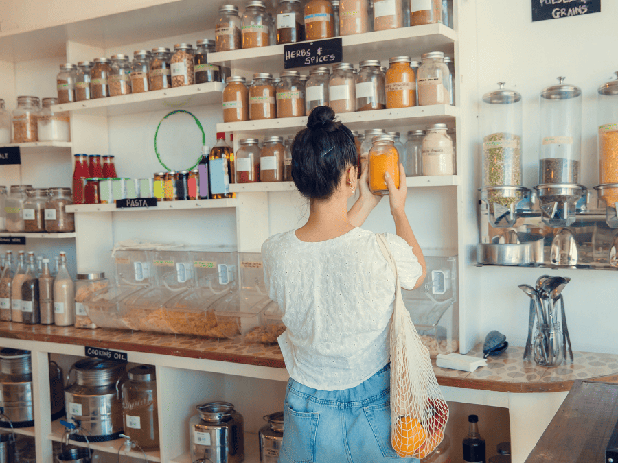 A women shopping in a package free store for her zero waste kitchen