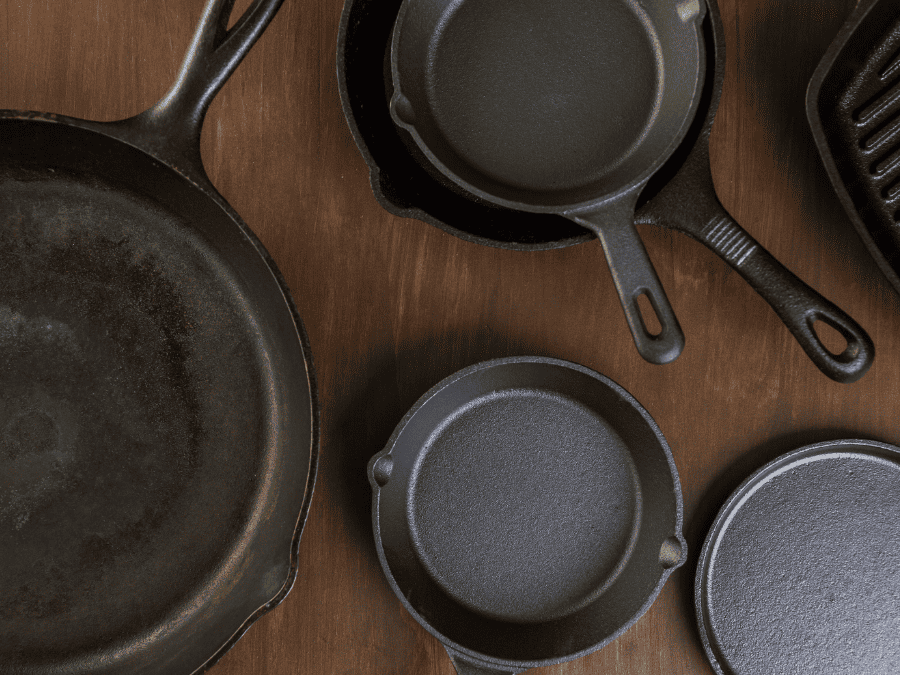 Cast iron pans on a wooden table